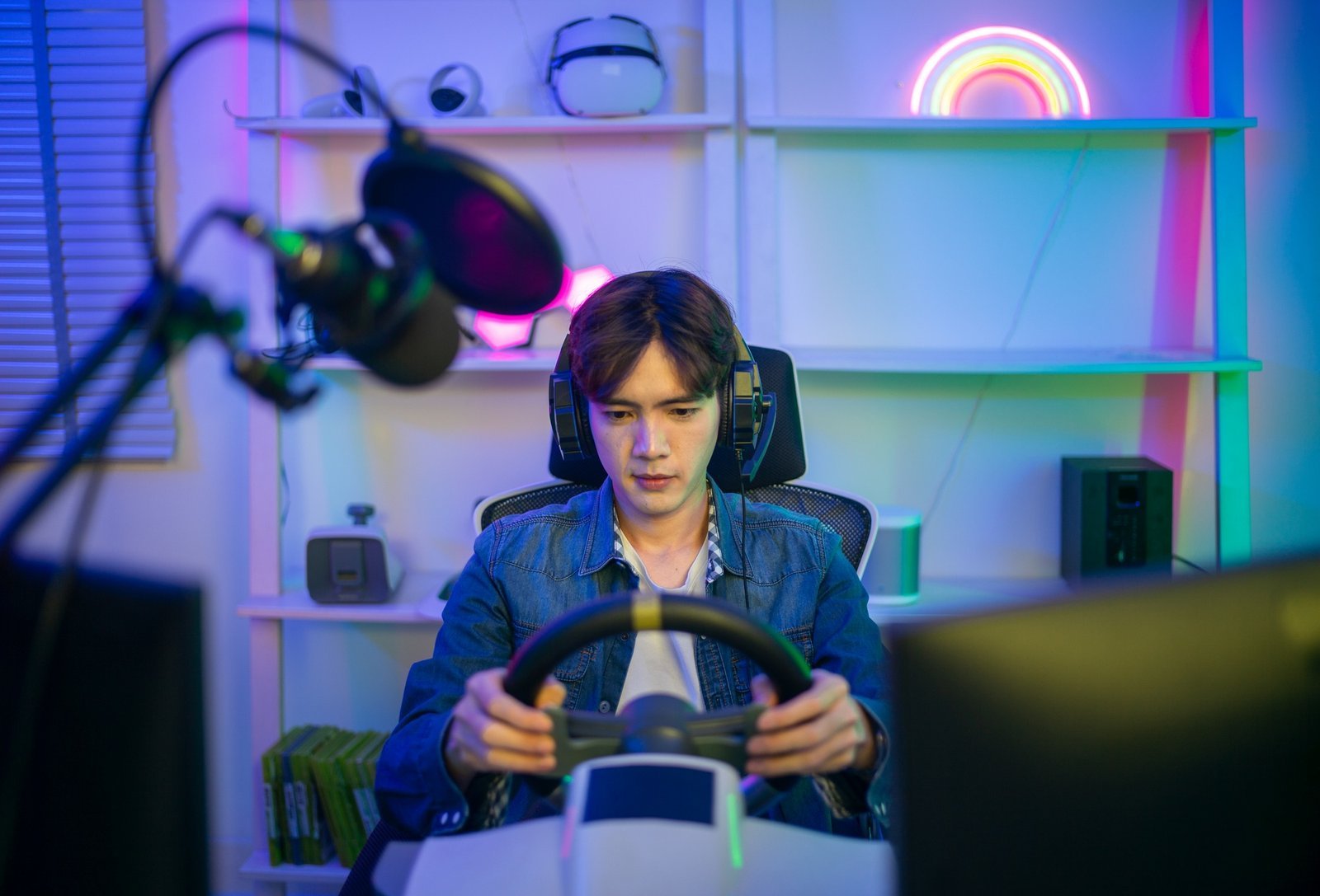 Professional gamer and online streamer in virtual car racing game communicate with his followers